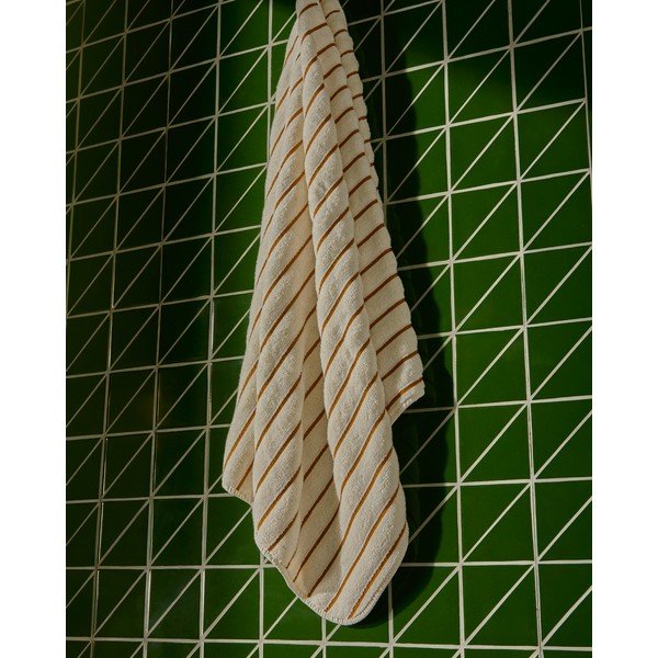 Oranžna/bež frotirna bombažna brisača 70x140 cm Dorane – Kave Home-image-3