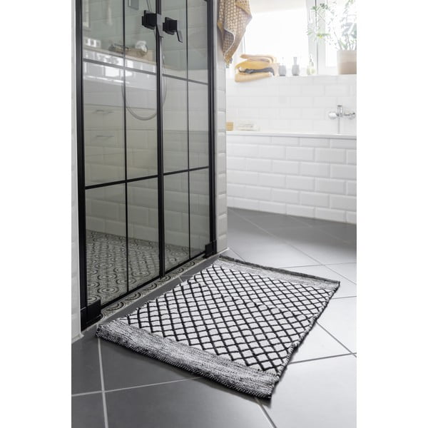 Črno-bela kopalniška preproga iz reciklirane plastike 50x80 cm Tara – Wenko-image-1