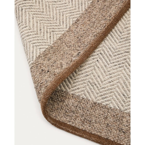 Bež obojestranska ročno tkana volnena preproga 200x300 cm Nifelia – Kave Home-image-1