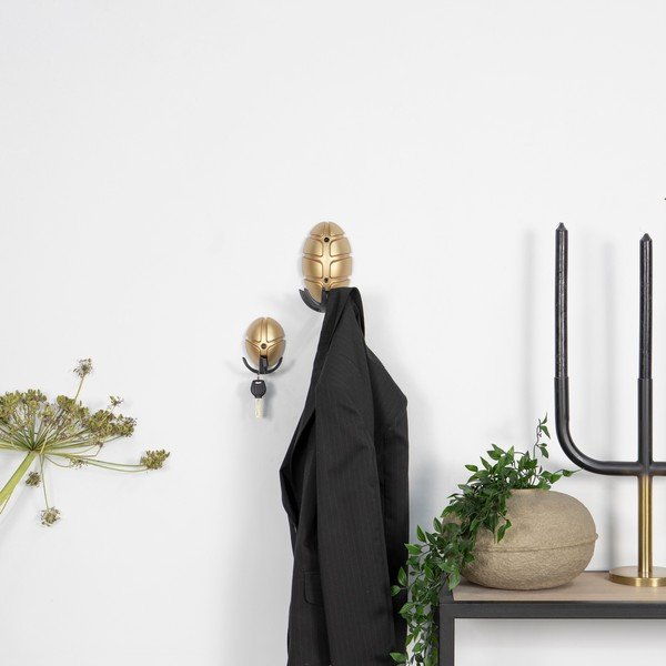 Črn/v zlati barvi plastičen stenski obešalnik Tick – Spinder Design-image-1